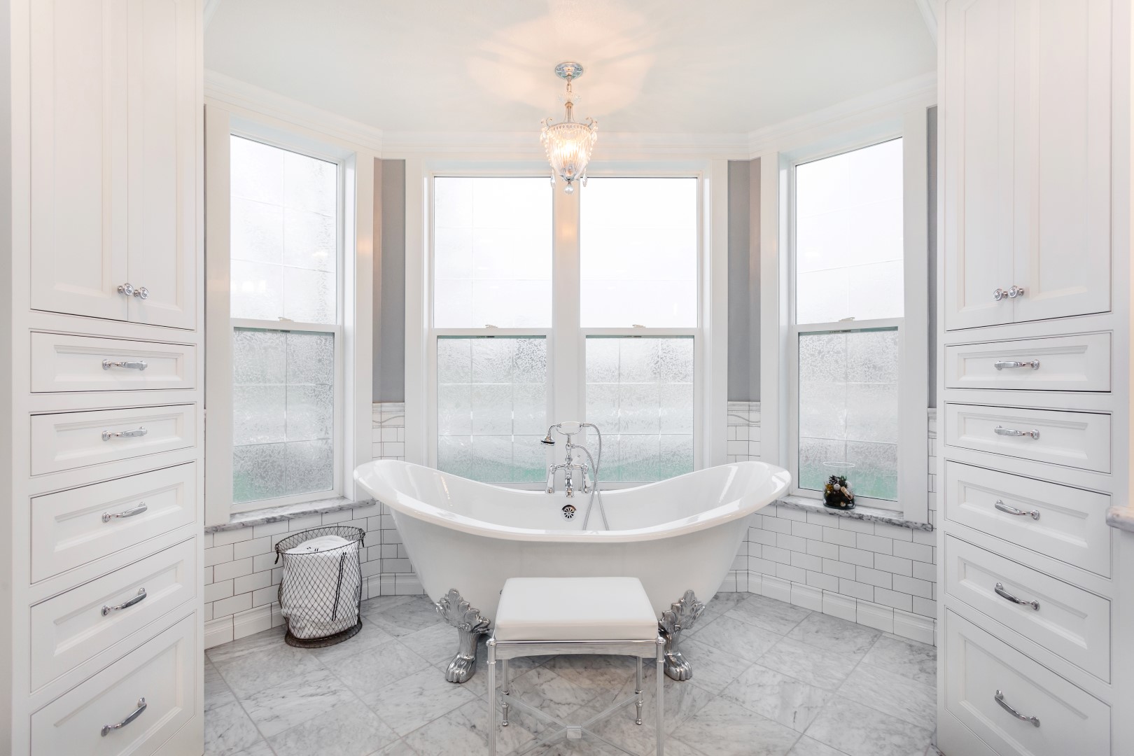 Custom bathroom cabinetry and marble flooring installed by The Interior